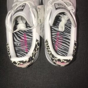 Adidas , endorsed by Stan Smith